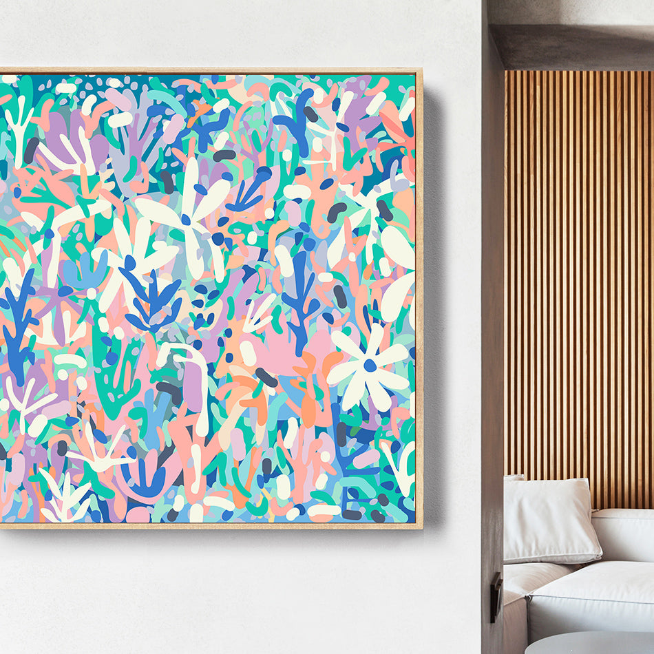 Colorful abstract painting on a white wall with a modern interior setting.